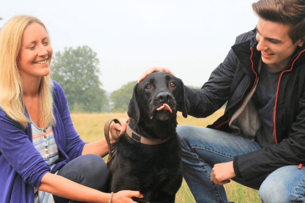 Doggy Member Oso, with owner Anna and borrower Michael enjoying a fuss